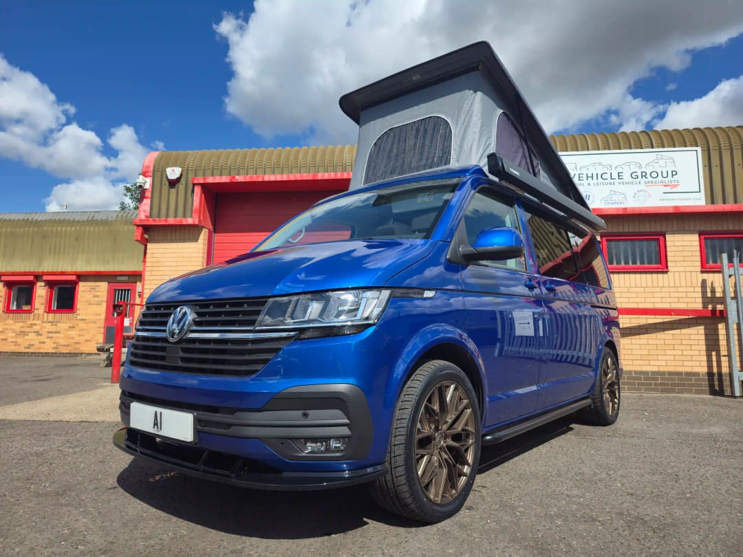 A  blue VW campervan